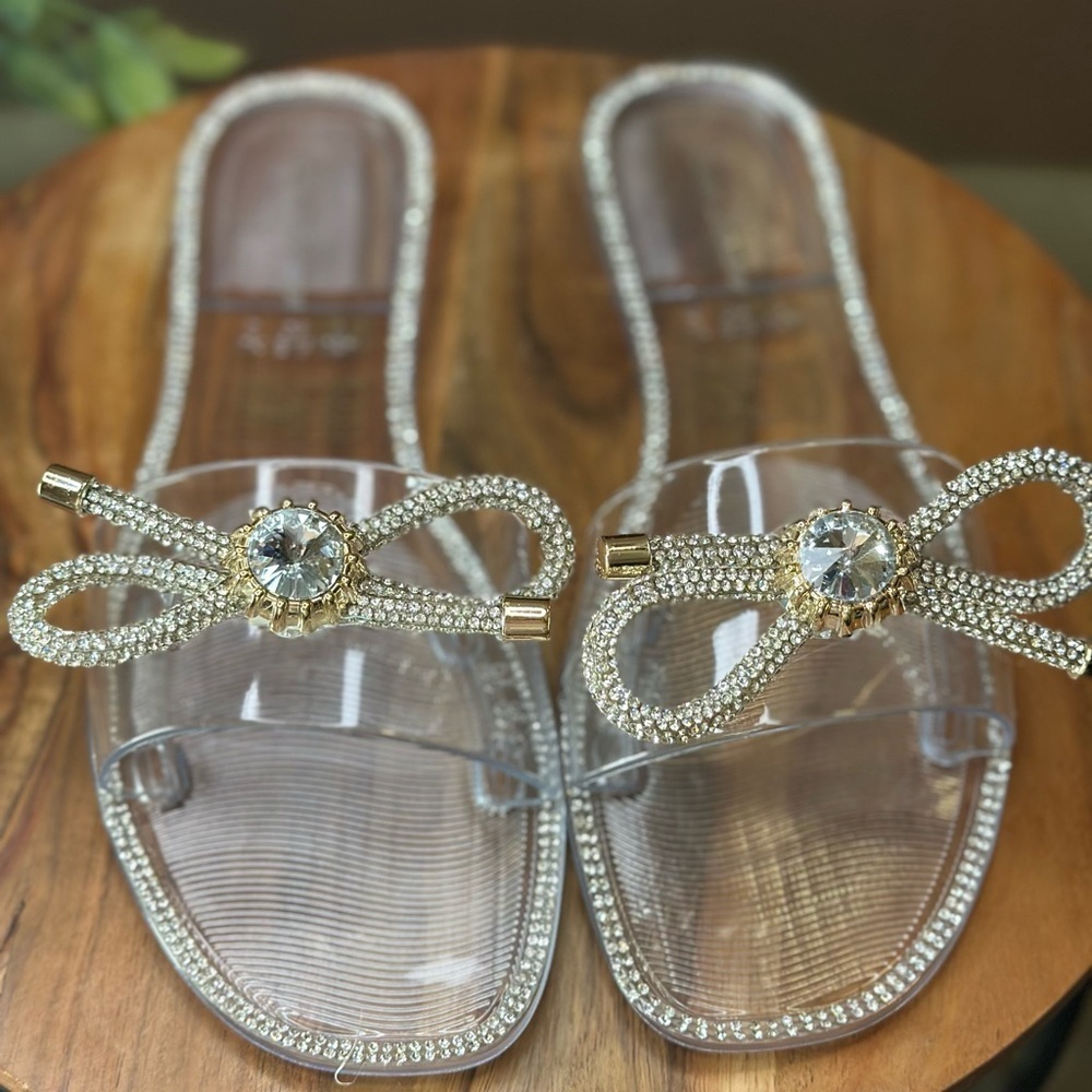 Lauren Lorraine Clear and Gold Bow Sandals